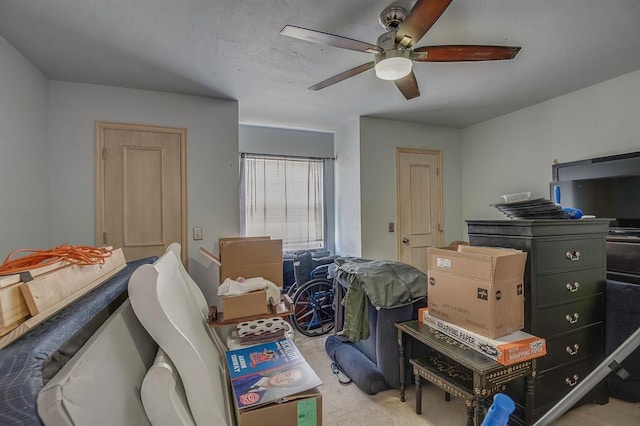 bedroom featuring light colored carpet and ceiling fan