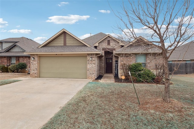 view of front of home with a garage and a front yard