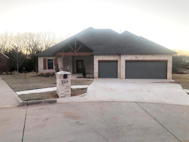 view of front of home featuring driveway and an attached garage