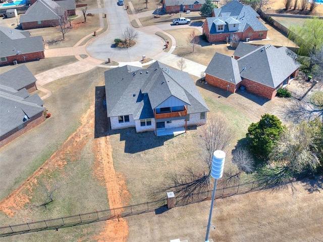 birds eye view of property with a residential view