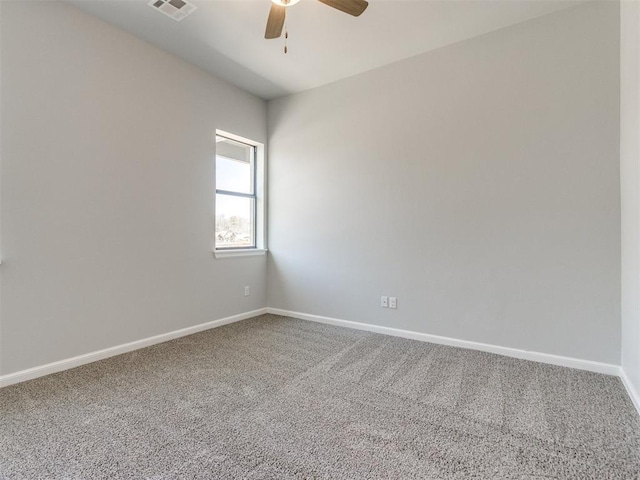 817 Carrie Ct, Purcell, OK 73080 - spare room with visible vents, ceiling fan, baseboards, and carpet