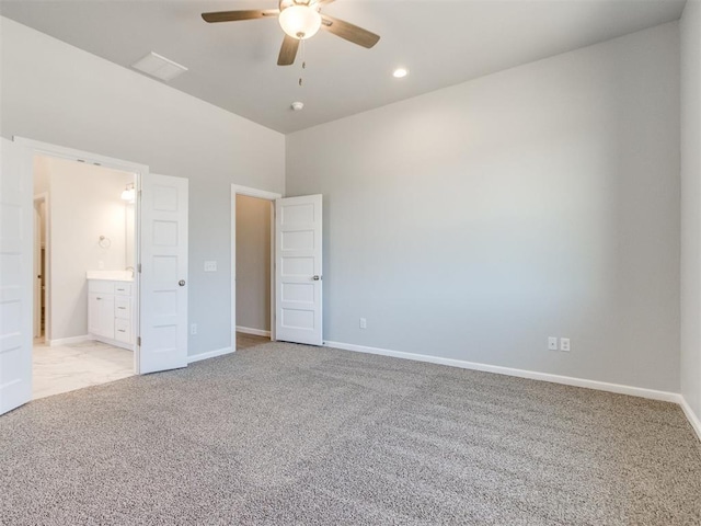 817 Carrie Ct, Purcell, OK 73080 - unfurnished bedroom with connected bathroom, baseboards, ceiling fan, light colored carpet, and recessed lighting