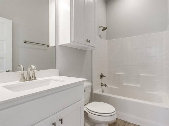 817 Carrie Ct, Purcell, OK 73080 - full bathroom featuring toilet, vanity,  shower combination, and wood finished floors