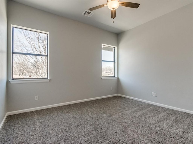 817 Carrie Ct, Purcell, OK 73080 - empty room featuring visible vents, carpet flooring, baseboards, and a ceiling fan