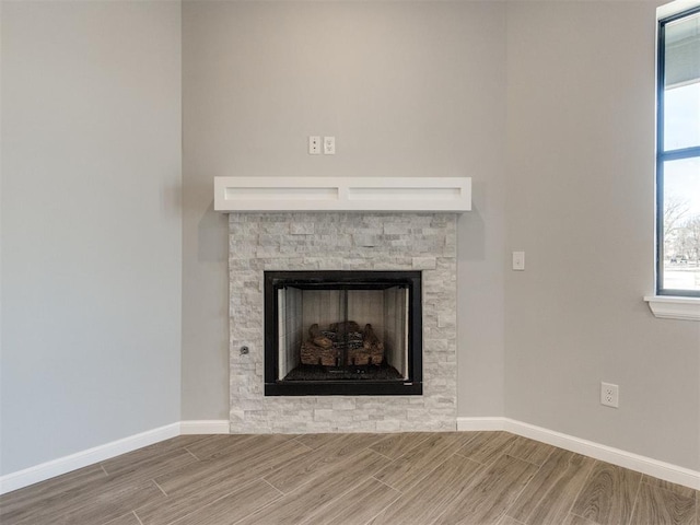 817 Carrie Ct, Purcell, OK 73080 - interior details with a stone fireplace, baseboards, and wood finish floors