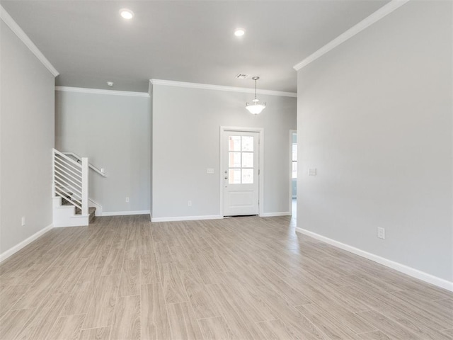 817 Carrie Ct, Purcell, OK 73080 - empty room featuring baseboards, light wood-style flooring, stairs, and ornamental molding