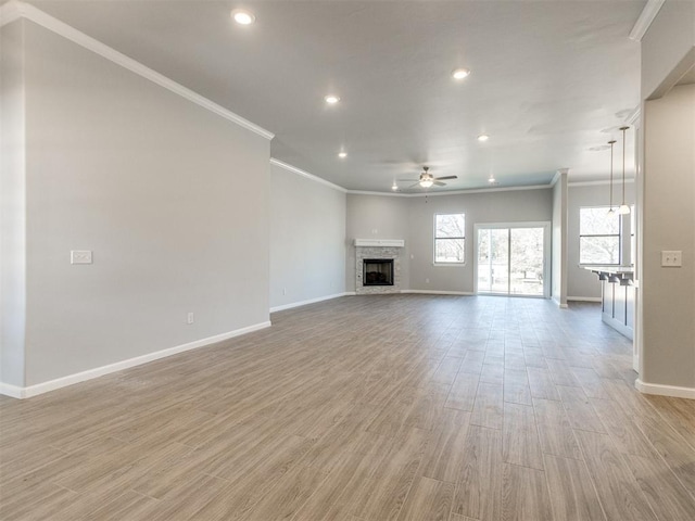 817 Carrie Ct, Purcell, OK 73080 - unfurnished living room with recessed lighting, a fireplace, light wood finished floors, baseboards, and ceiling fan