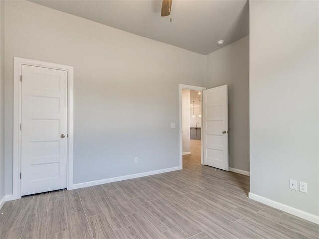 817 Carrie Ct, Purcell, OK 73080 - empty room with baseboards, ceiling fan, and light wood finished floors