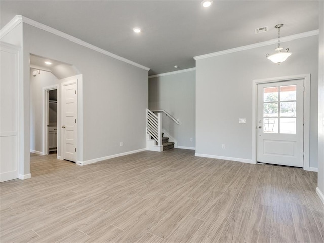 817 Carrie Ct, Purcell, OK 73080 - unfurnished living room featuring light wood finished floors, visible vents, stairs, and baseboards