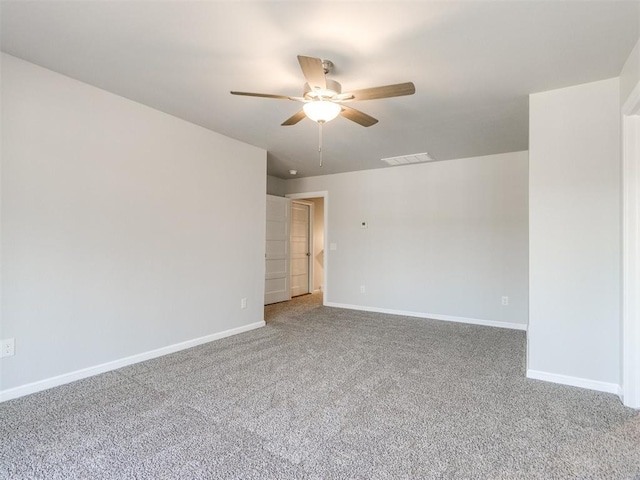 817 Carrie Ct, Purcell, OK 73080 - carpeted spare room featuring a ceiling fan, visible vents, and baseboards