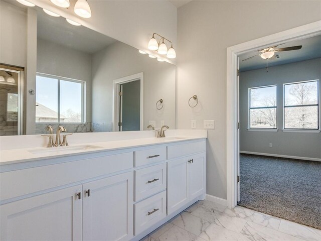 817 Carrie Ct, Purcell, OK 73080 - full bathroom featuring double vanity, marble finish floor, baseboards, and a sink