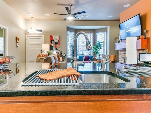 kitchen featuring sink, pendant lighting, and ceiling fan