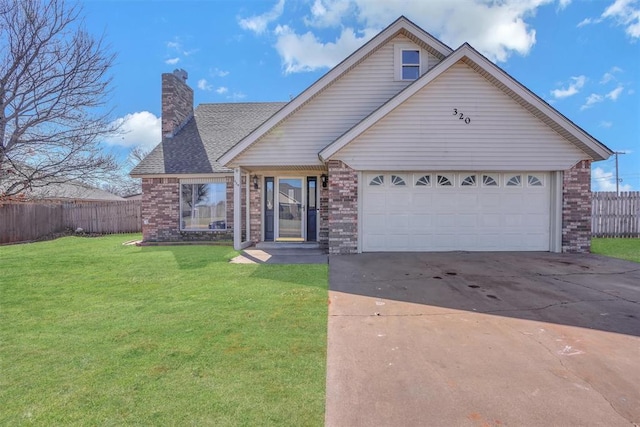 view of front of house featuring brick siding, fence, concrete driveway, a chimney, and a front yard