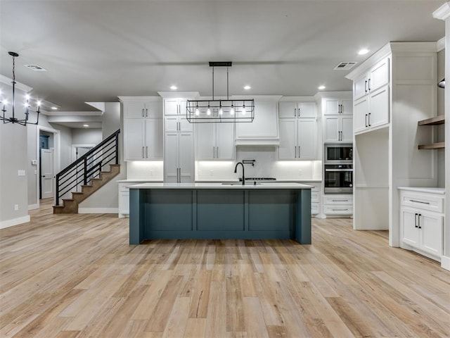 3134 NW 37th St, Newcastle, OK 73065 - kitchen with appliances with stainless steel finishes, a chandelier, recessed lighting, white cabinets, and a sink