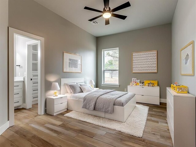 3134 NW 37th St, Newcastle, OK 73065 - bedroom with light wood-style floors, connected bathroom, ceiling fan, and baseboards