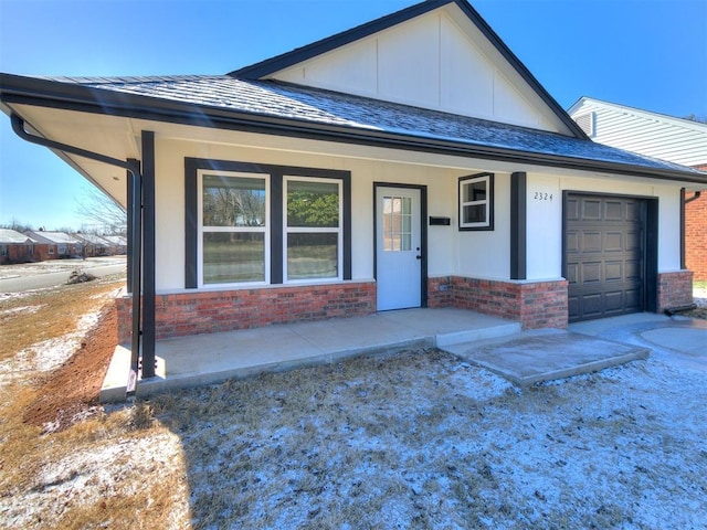 view of front of house with a garage and a porch