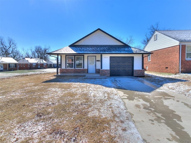 view of front of property featuring a garage and a porch