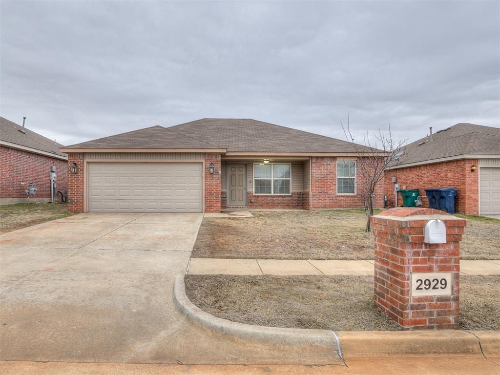 ranch-style home featuring a garage