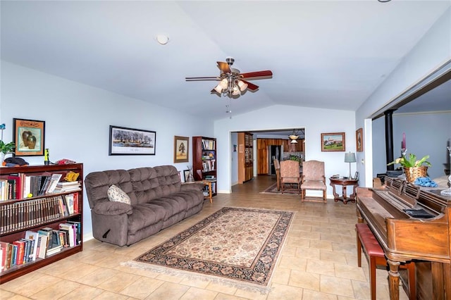 living room featuring vaulted ceiling and ceiling fan