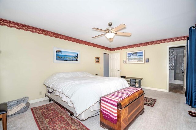 1901 E 15th St, Chandler, OK 74834 - bedroom featuring light carpet, baseboards, and a ceiling fan