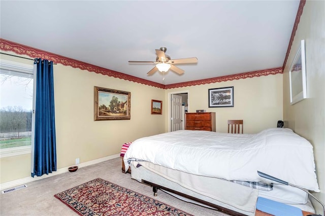 1901 E 15th St, Chandler, OK 74834 - bedroom featuring carpet, baseboards, and a ceiling fan
