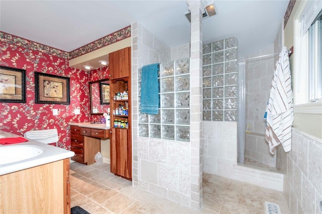 1901 E 15th St, Chandler, OK 74834 - full bath with vanity, walk in shower, tile patterned floors, and wallpapered walls