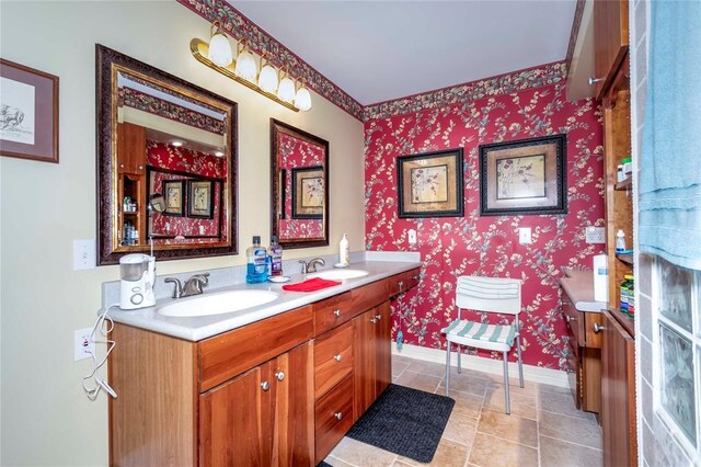1901 E 15th St, Chandler, OK 74834 - bathroom featuring double vanity, wallpapered walls, and baseboards