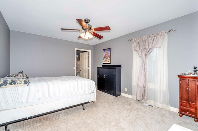 1901 E 15th St, Chandler, OK 74834 - bedroom with carpet, baseboards, and ceiling fan