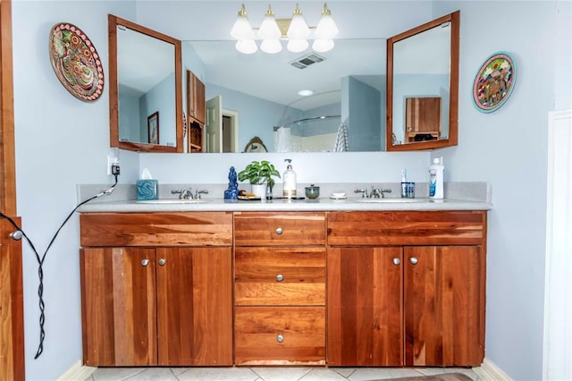 1901 E 15th St, Chandler, OK 74834 - full bathroom with double vanity, tile patterned flooring, a shower, and baseboards