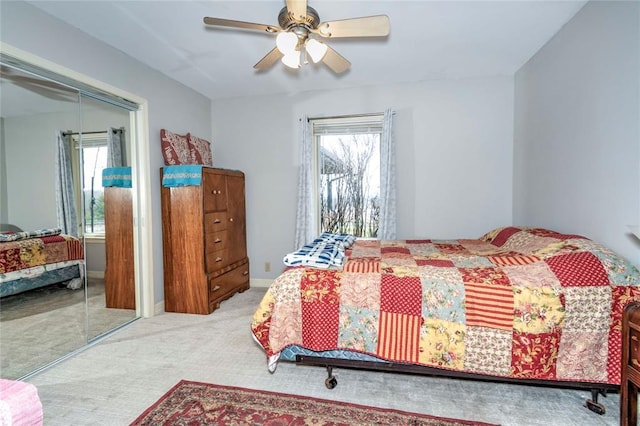 1901 E 15th St, Chandler, OK 74834 - carpeted bedroom with multiple windows, a closet, and ceiling fan