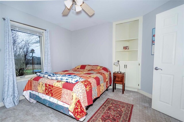 1901 E 15th St, Chandler, OK 74834 - bedroom featuring carpet flooring, ceiling fan, and baseboards