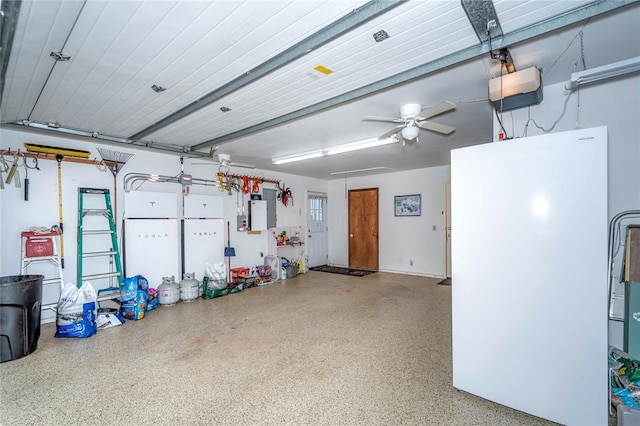 1901 E 15th St, Chandler, OK 74834 - garage with a garage door opener and a ceiling fan