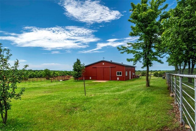 1901 E 15th St, Chandler, OK 74834 - view of yard with an outbuilding, an outdoor structure, a garage, and a view of countryside