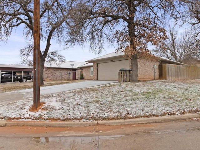 view of front of house with a carport and a garage