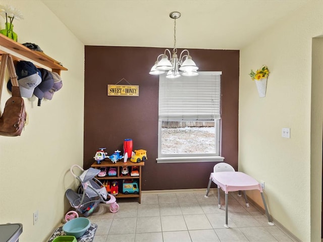 rec room with light tile patterned floors and a notable chandelier