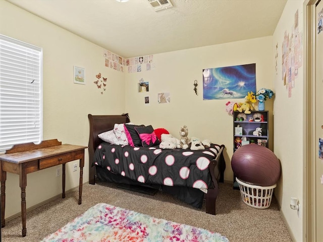 bedroom with light carpet