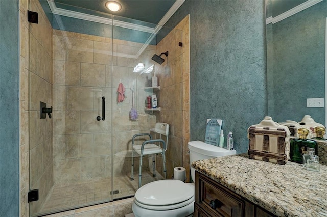 bathroom featuring crown molding, a shower with shower door, vanity, and toilet