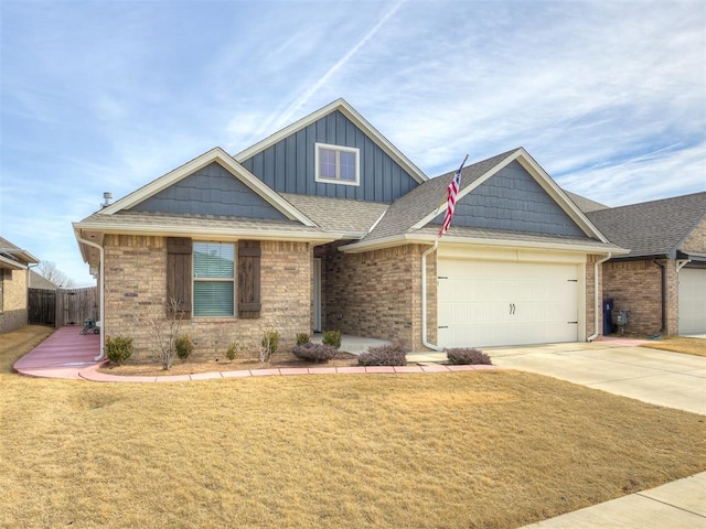 view of front of home with a garage and a front yard