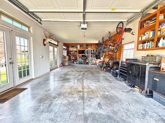 11501 Buckingham Ct, Yukon, OK 73099 - garage featuring french doors and a garage door opener