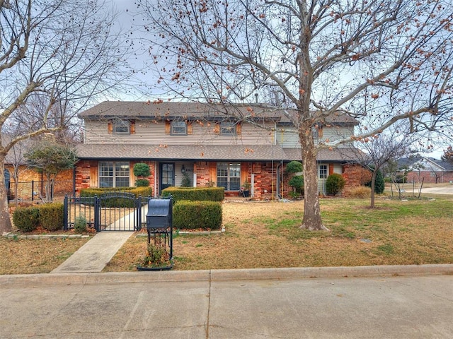 11501 Buckingham Ct, Yukon, OK 73099 - traditional home featuring a gate and roof with shingles