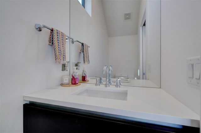 841 NW 6th St, Oklahoma City, OK 73106 - bathroom featuring vanity and vaulted ceiling