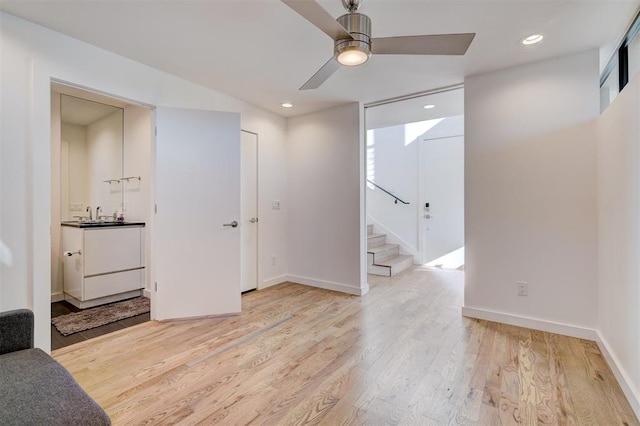 841 NW 6th St, Oklahoma City, OK 73106 - spare room with stairway, a ceiling fan, light wood-style floors, recessed lighting, and baseboards