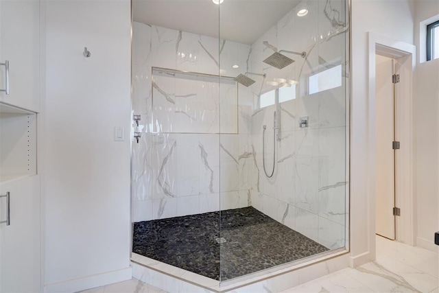 841 NW 6th St, Oklahoma City, OK 73106 - bathroom featuring a marble finish shower and marble look tile flooring