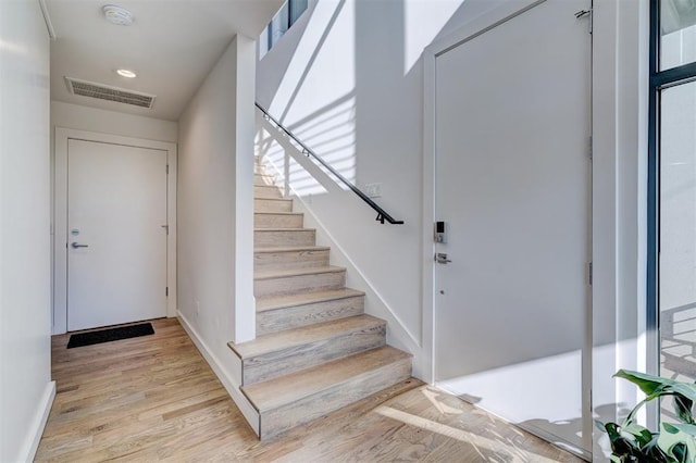 841 NW 6th St, Oklahoma City, OK 73106 - entryway featuring stairs, light wood finished floors, and baseboards