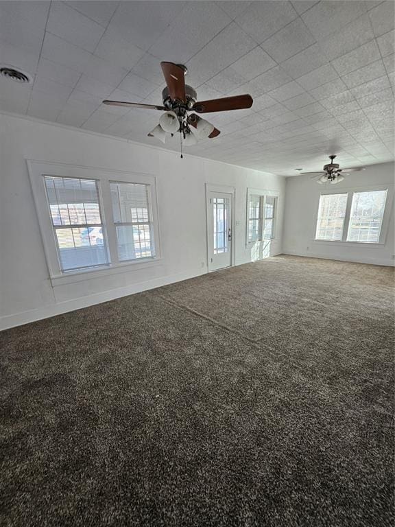 unfurnished room featuring carpet and ceiling fan