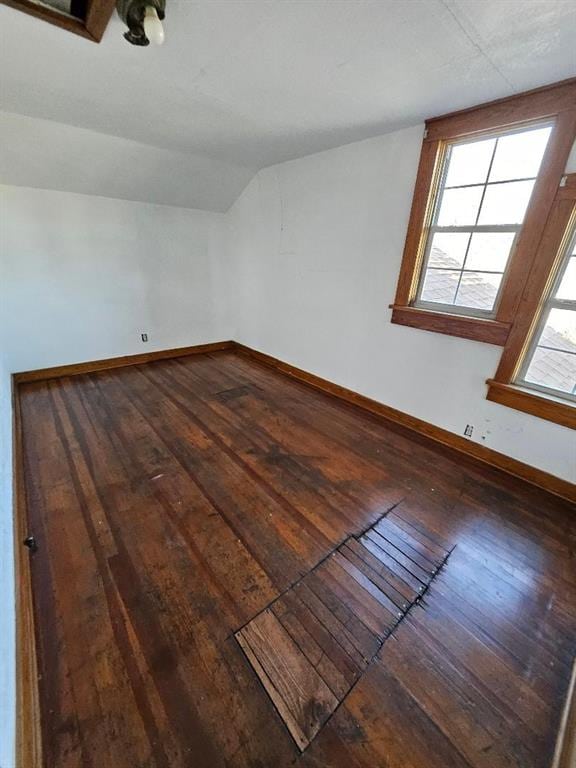 bonus room featuring hardwood / wood-style flooring and vaulted ceiling