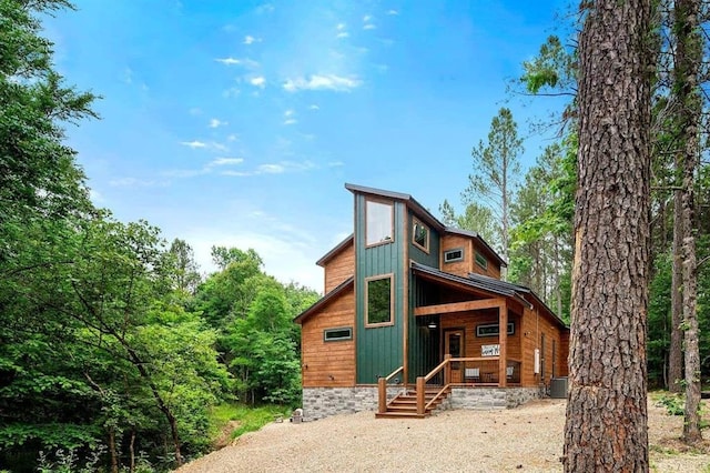 rear view of property with a porch