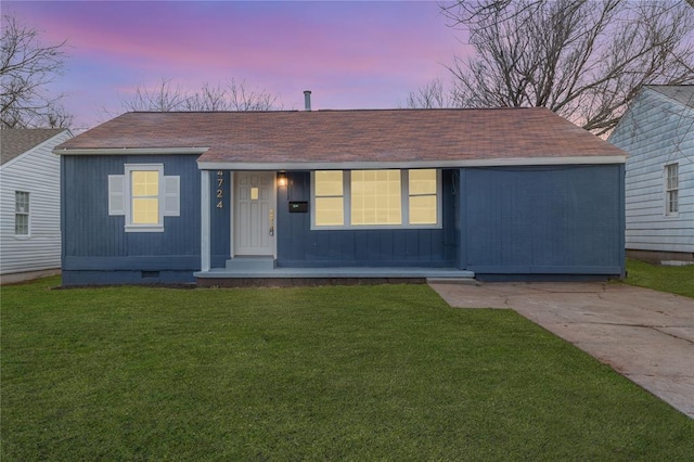 view of front of house with a yard