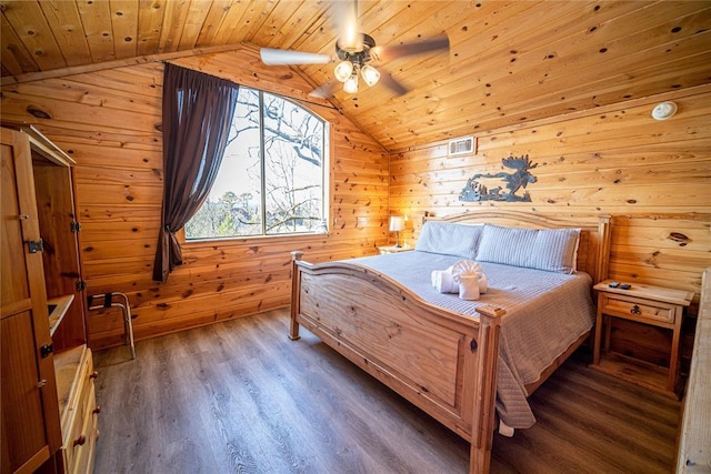 bedroom with lofted ceiling, dark wood-type flooring, ceiling fan, wooden ceiling, and wood walls