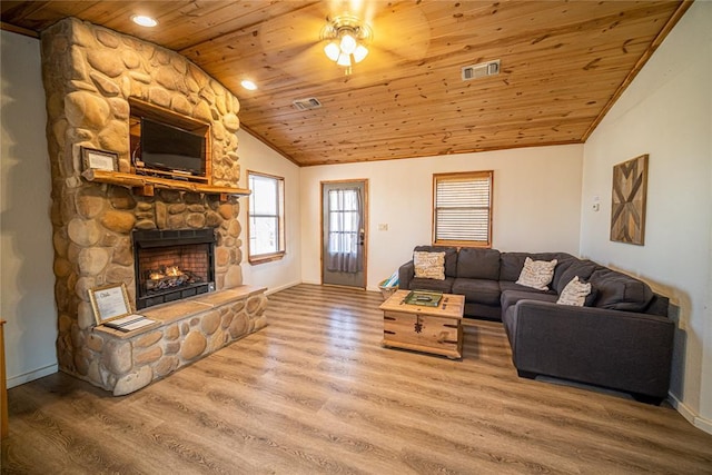 living room featuring a fireplace, wood-type flooring, lofted ceiling, ceiling fan, and wood ceiling